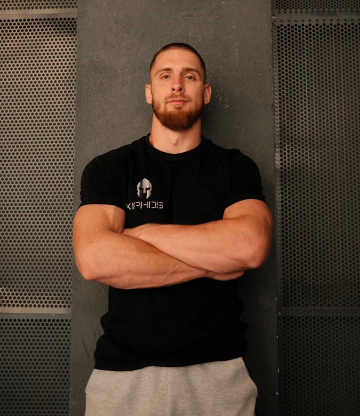 Luka standing with crossed arms in the gym