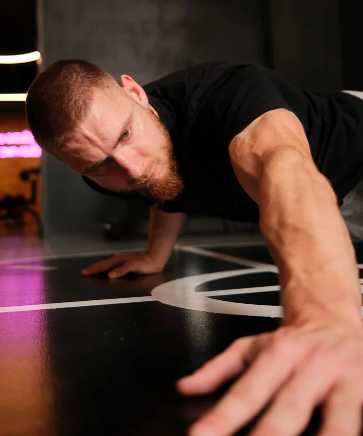 Luka training with an extended arm and hand in the foreground